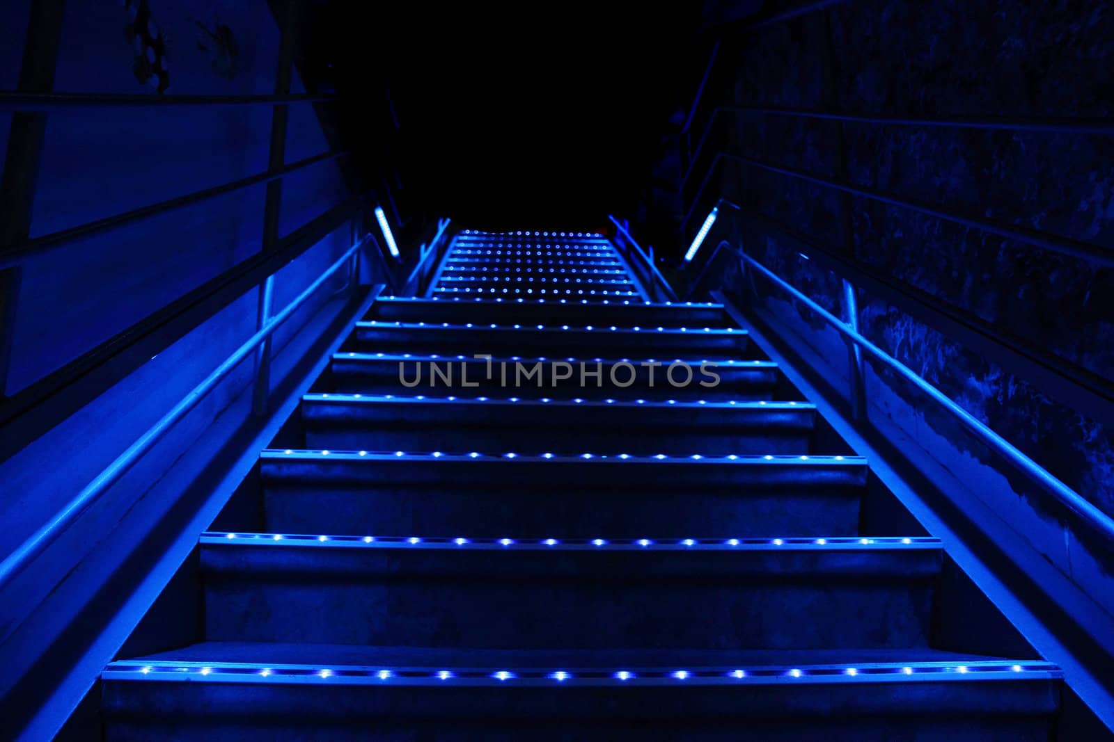 blue stairs with the lights in the dark night