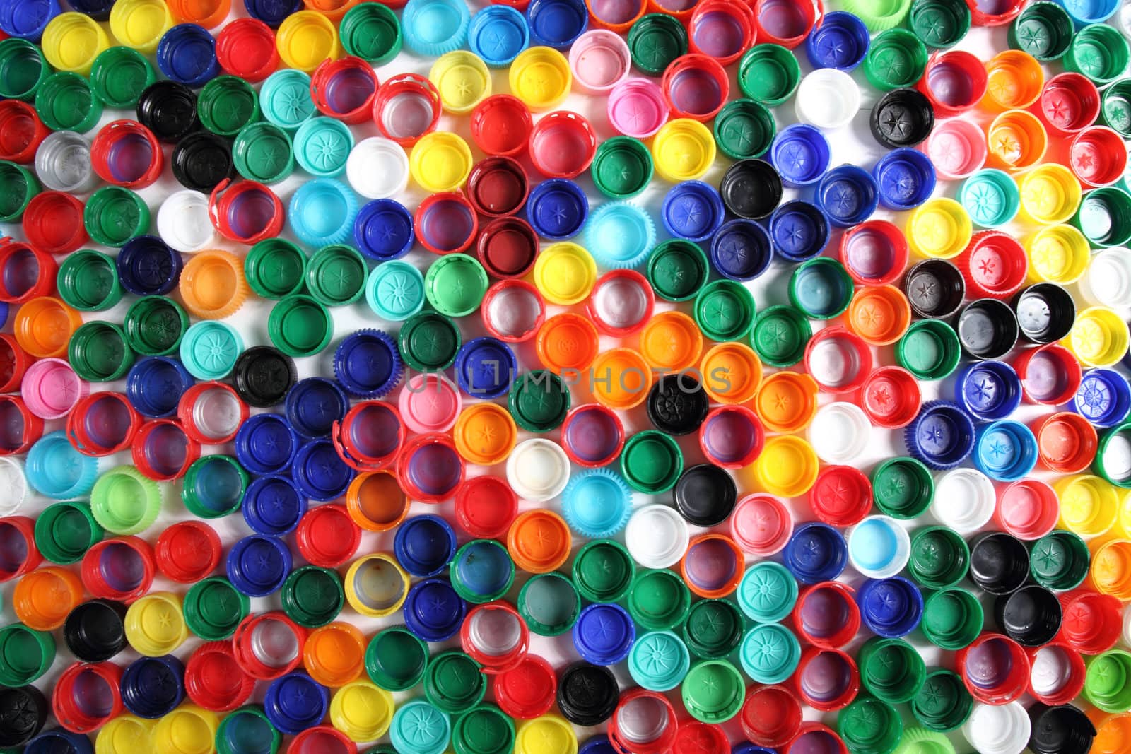 color caps as plastic background by jonnysek