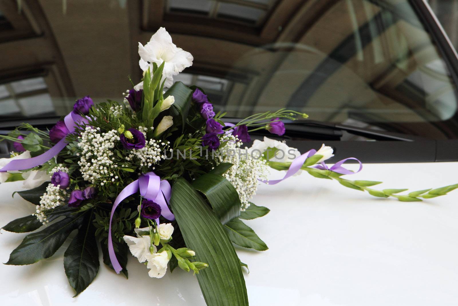 wedding flower background on the white car