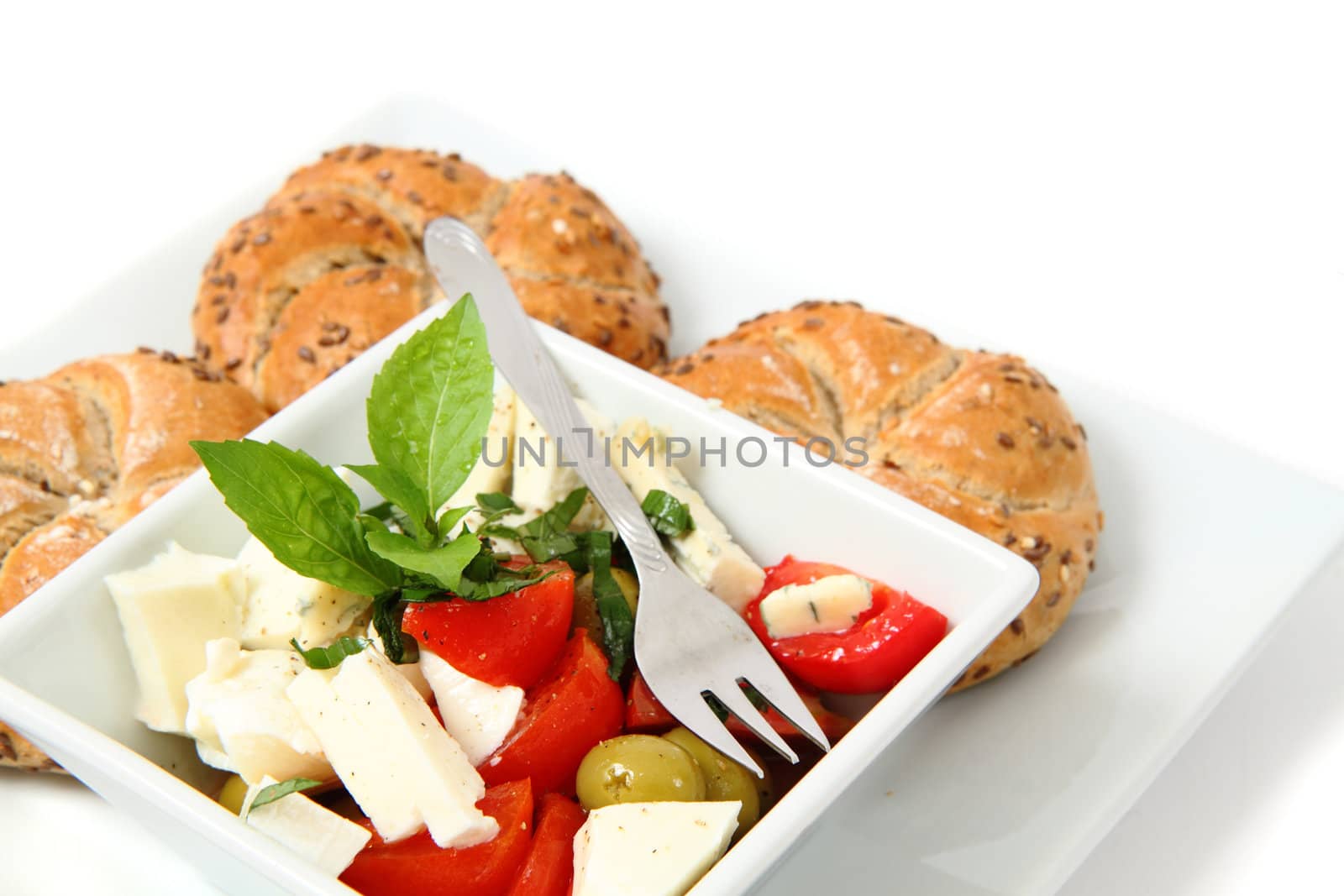 vegetable salad (tomato, basil, olive) isolated on the white background