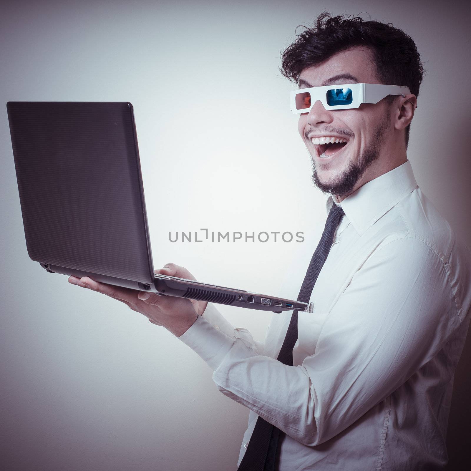 businessman with 3d eyewear watching laptop on gray background