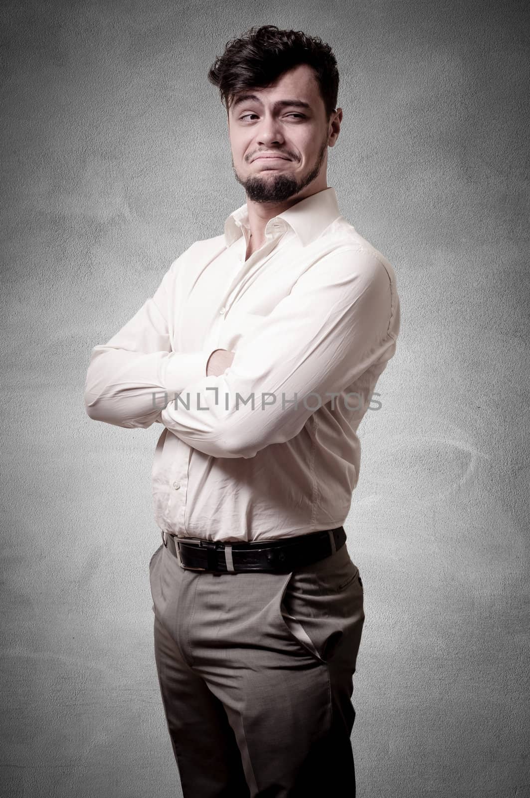 Stylish businessman on gray background