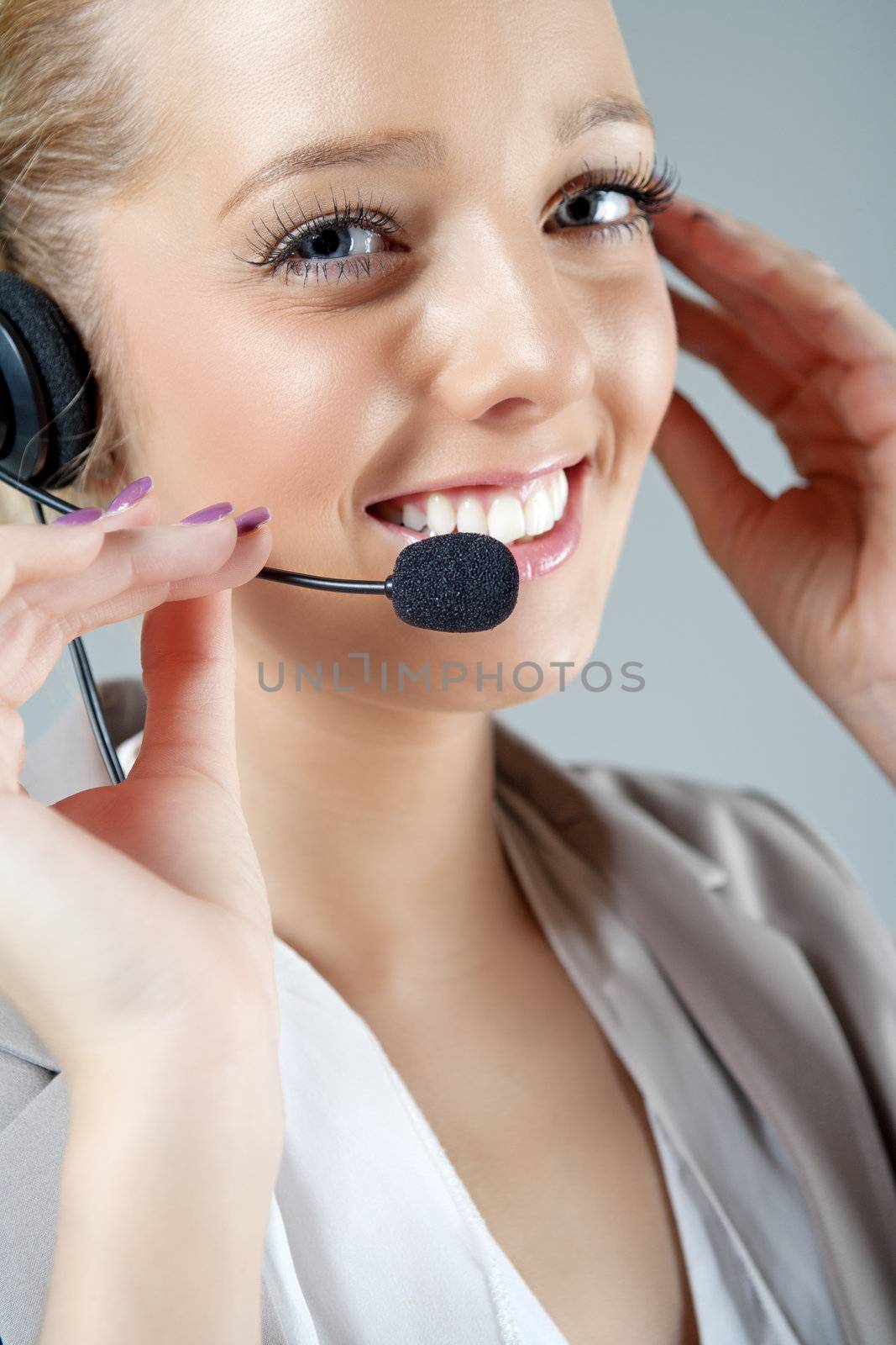 Call centre operator using a telephone headset.