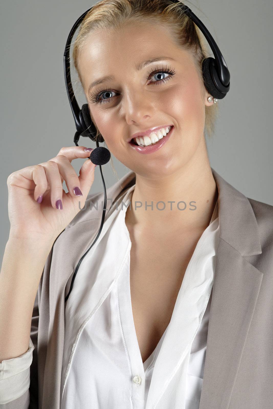 Call centre operator using a telephone headset.