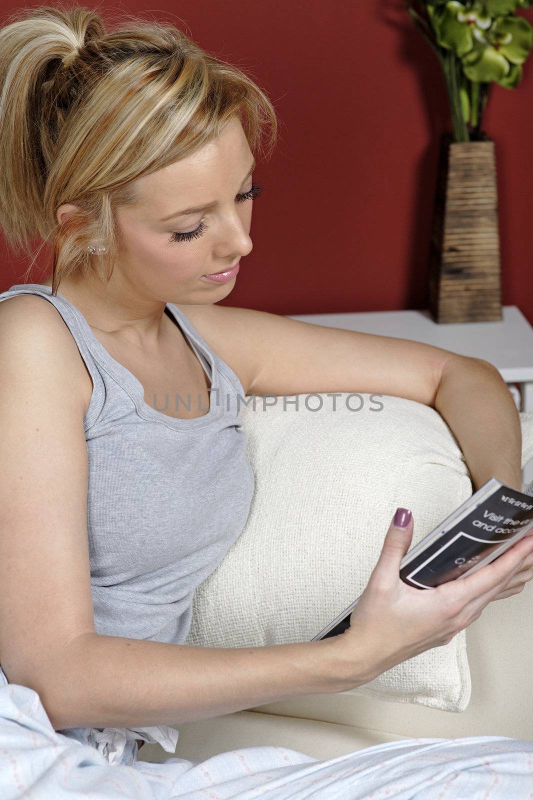 Woman resting on her sofa at home in casual clothes