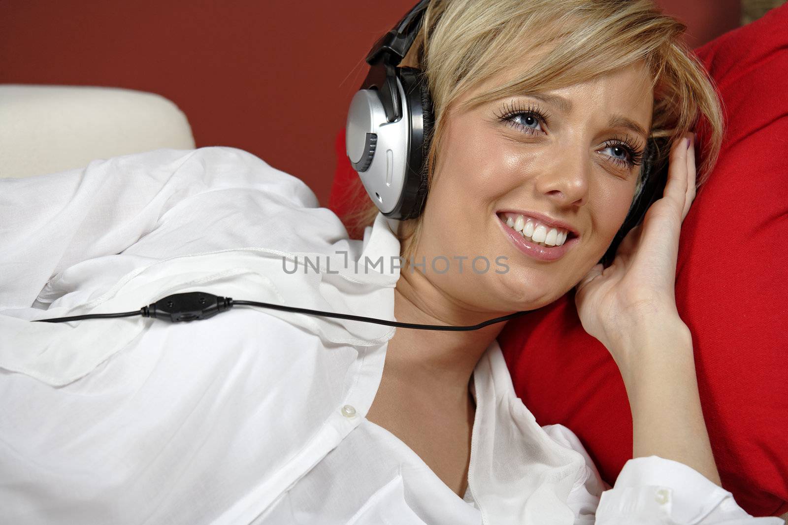 Woman listening to music by studiofi
