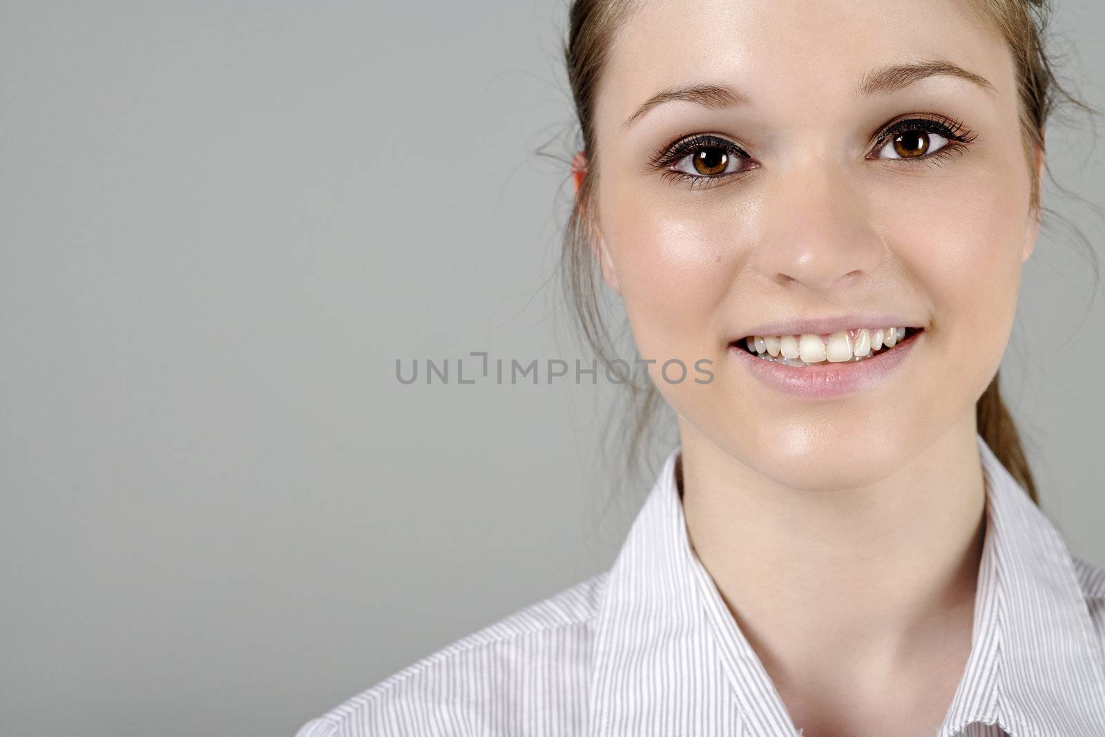 Young woman in smart shirt facing the camera