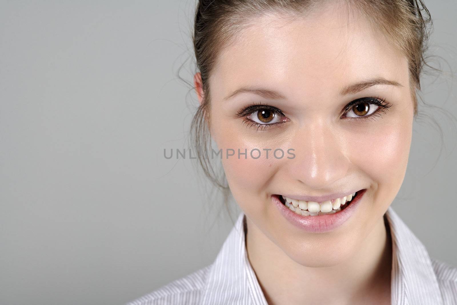 Young woman in smart shirt facing the camera