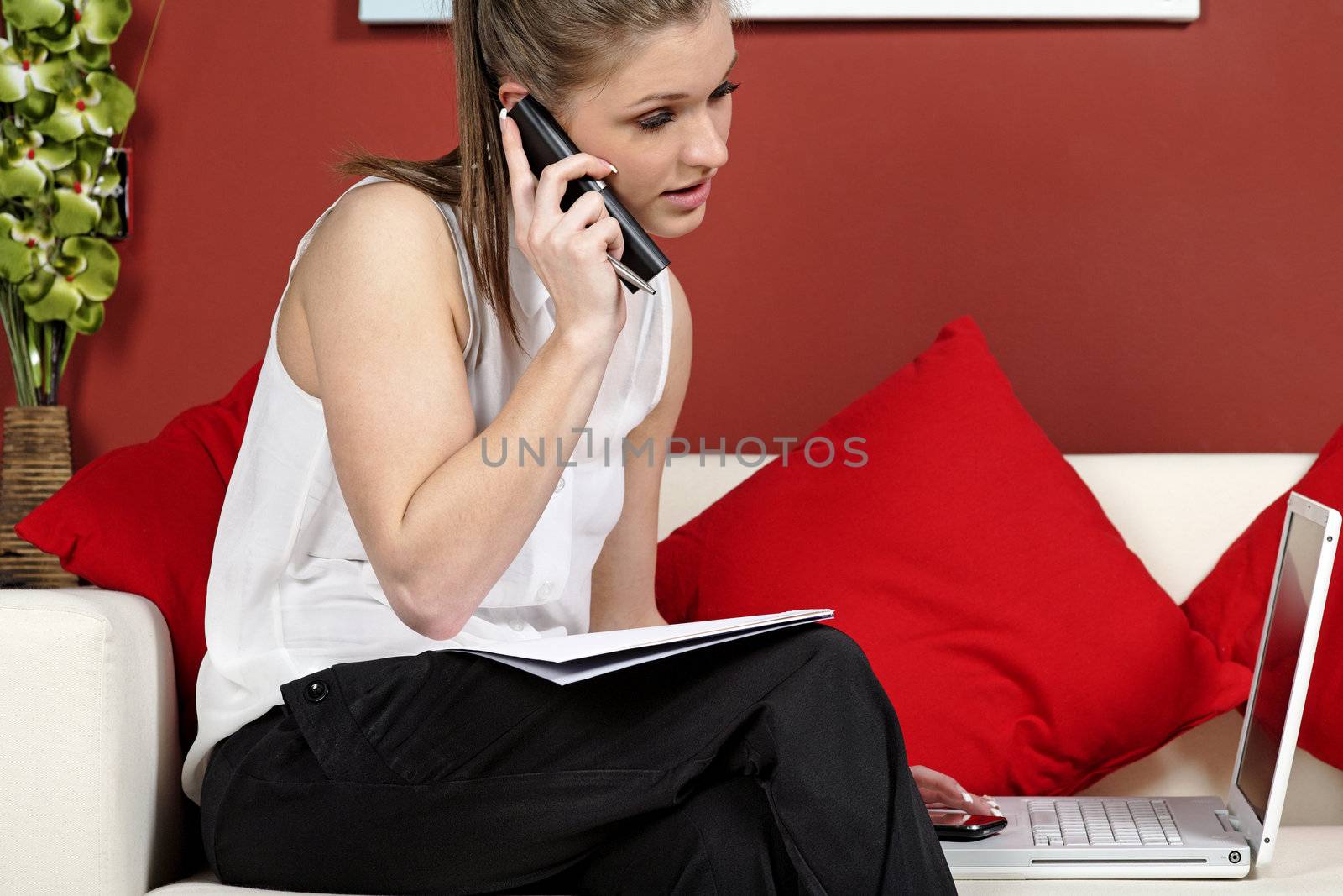 Young woman working from home on a laptop computer