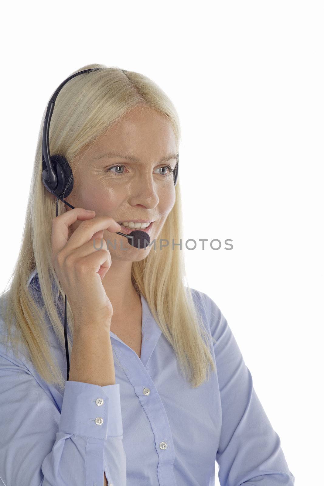 Young woman in smart clothes using a call centre head set