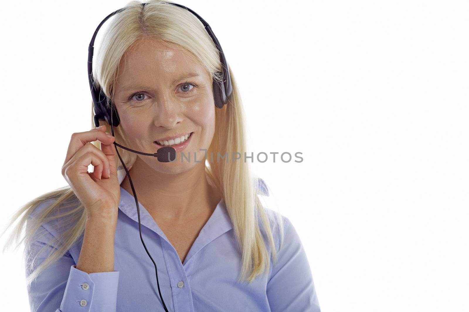 Young woman in smart clothes using a call centre head set