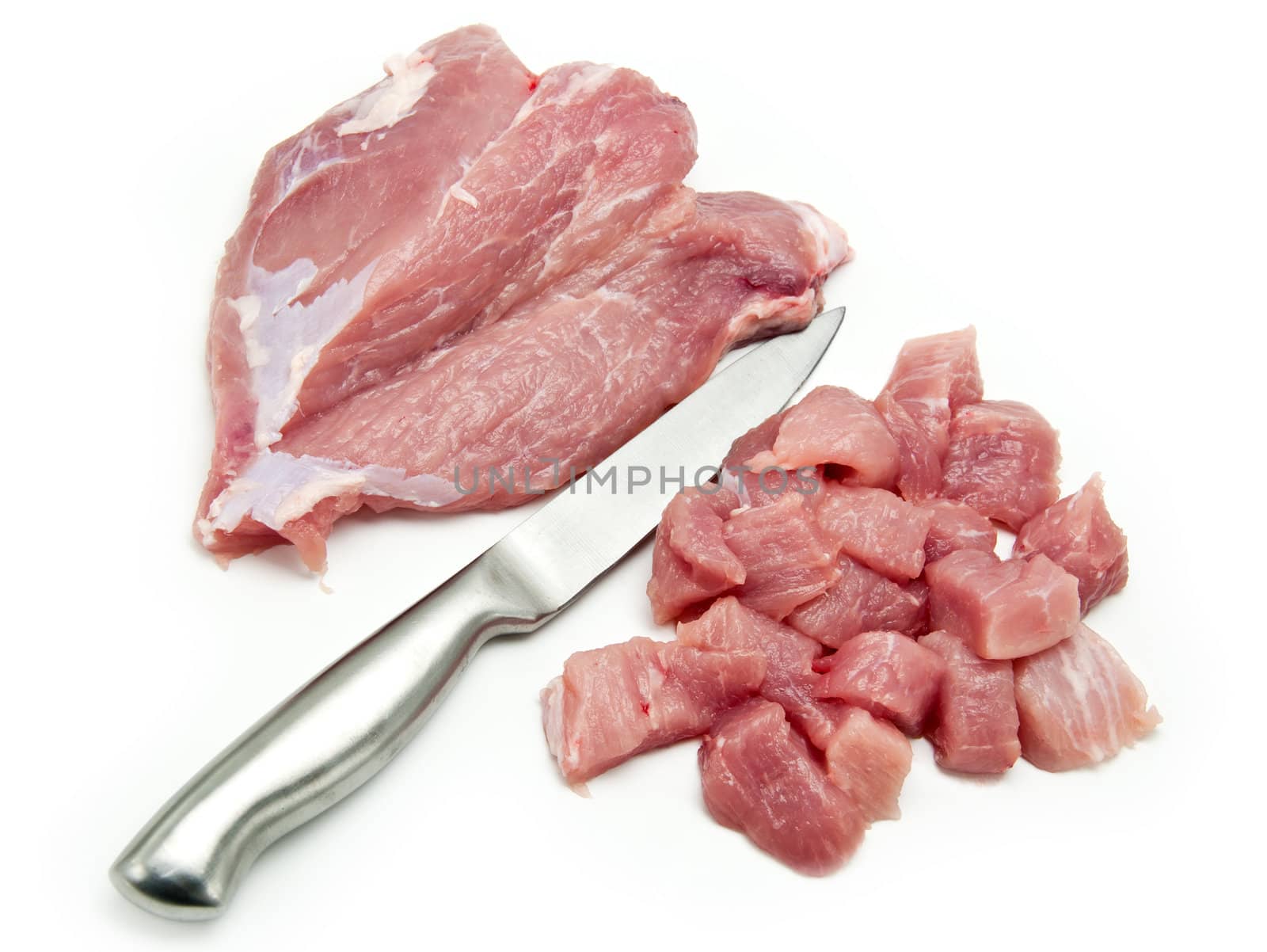 Pieces of fresh pork meat and knife isolated on a white background.