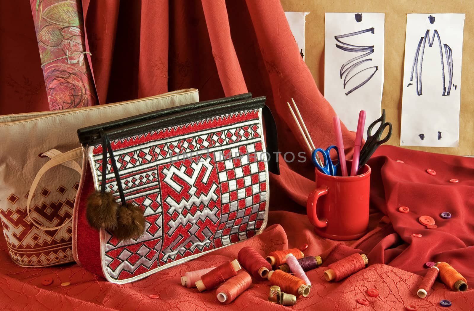 fashion sketches, handbags, red fabric, buttons and thread