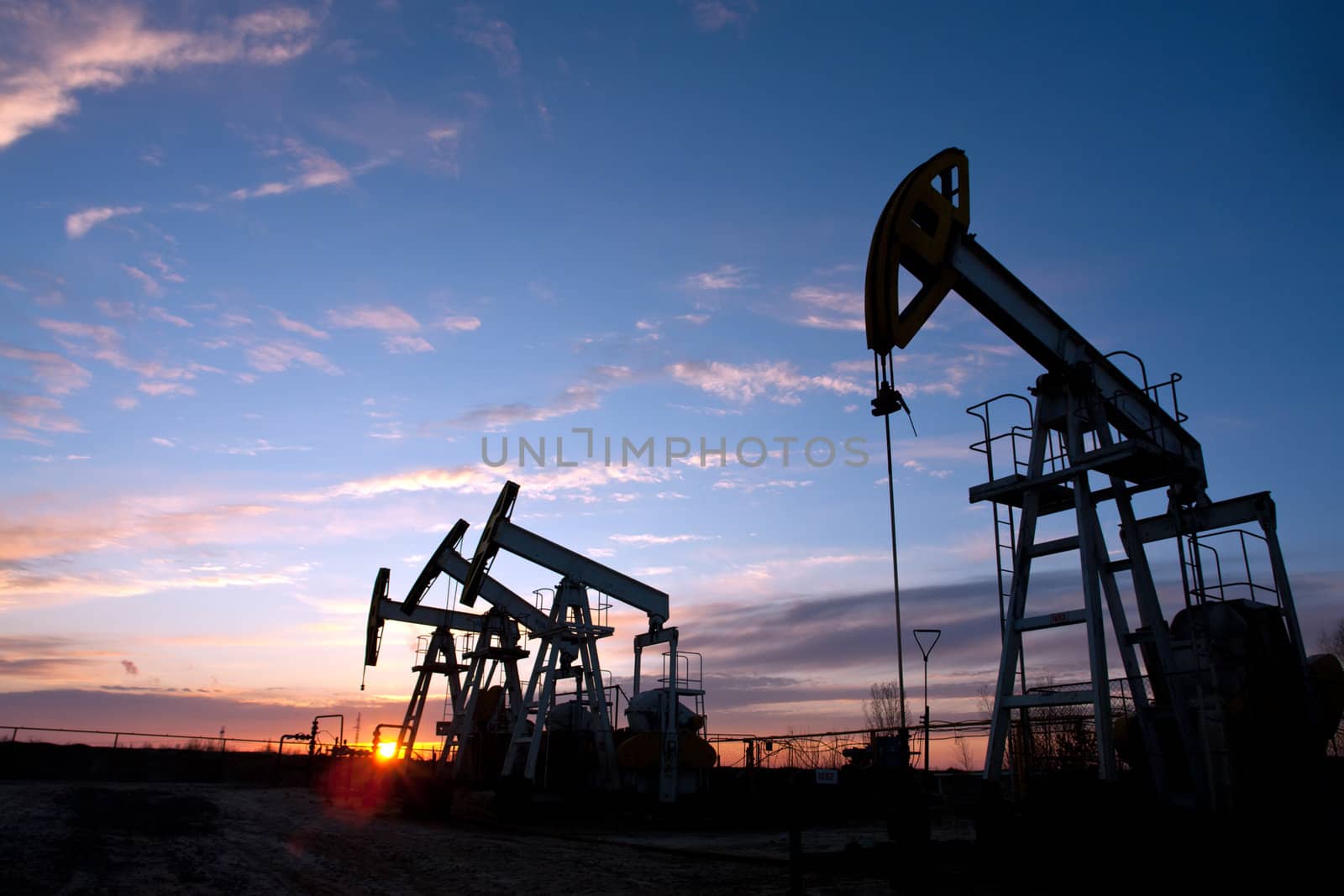 oil pumps on the sunset sky background 