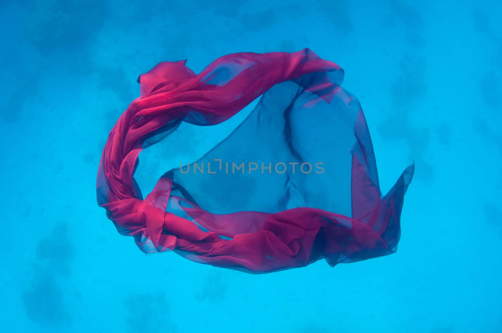 Abstract image of red fabric underwater background
