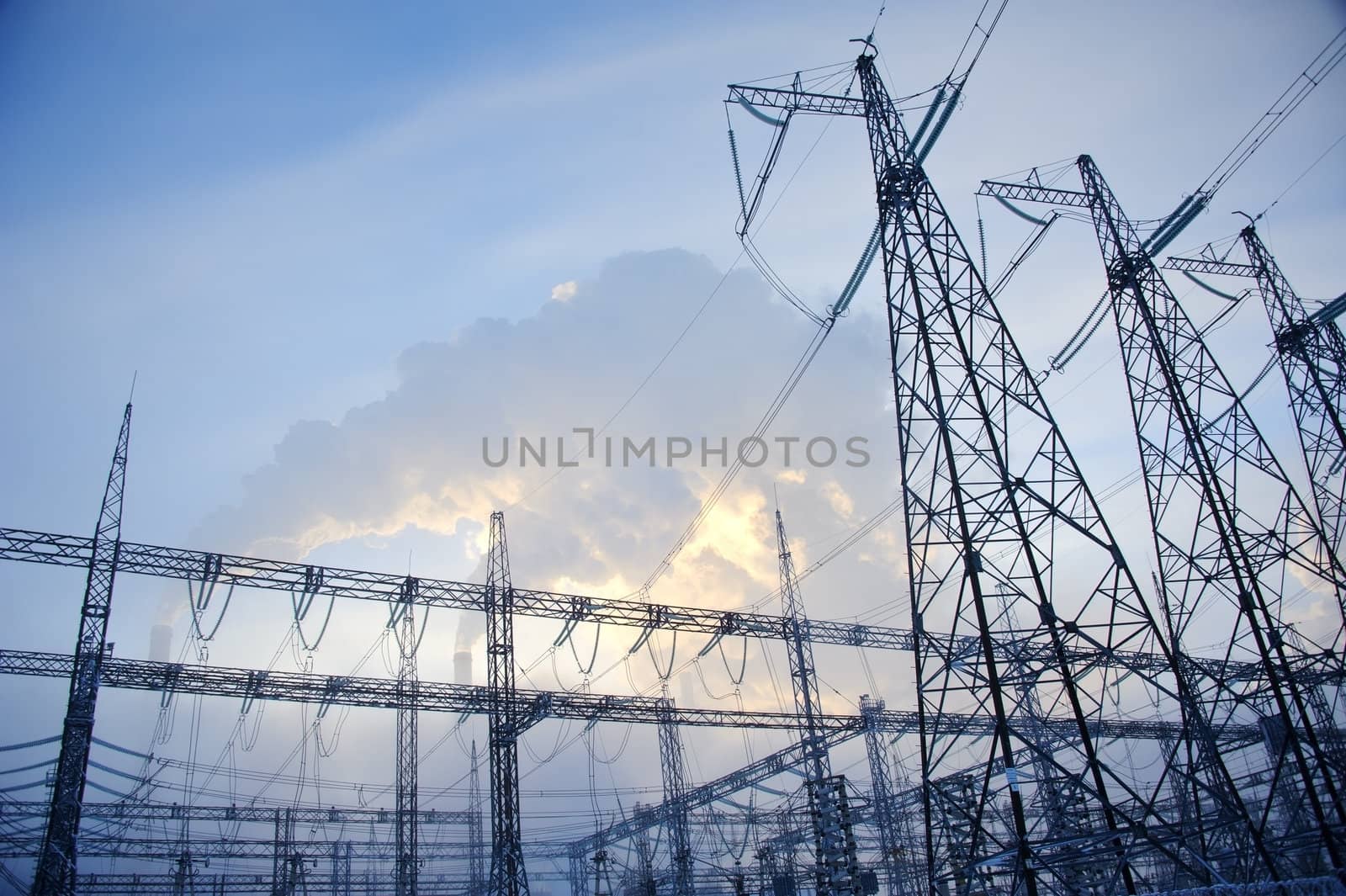 power lines against powerhouse smoke