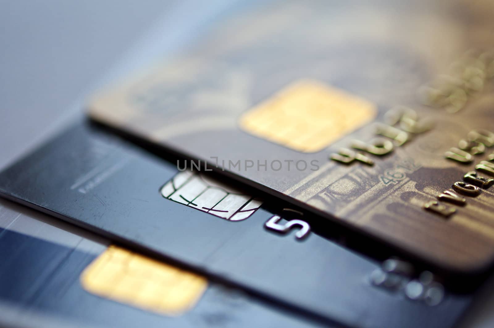  credit cards on a blue background, selective focus. closeup.