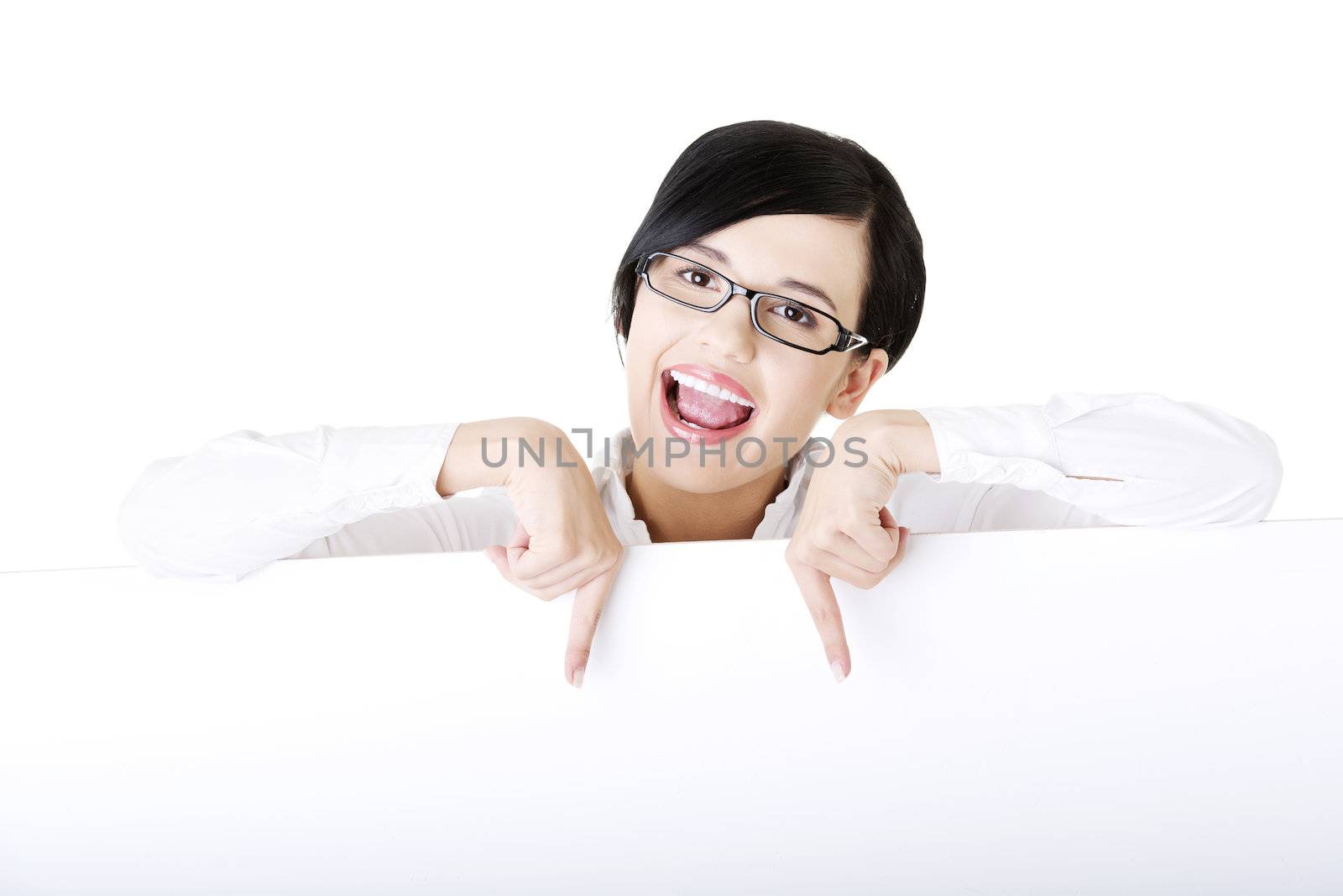 Smiling young business woman showing blank signboard by BDS