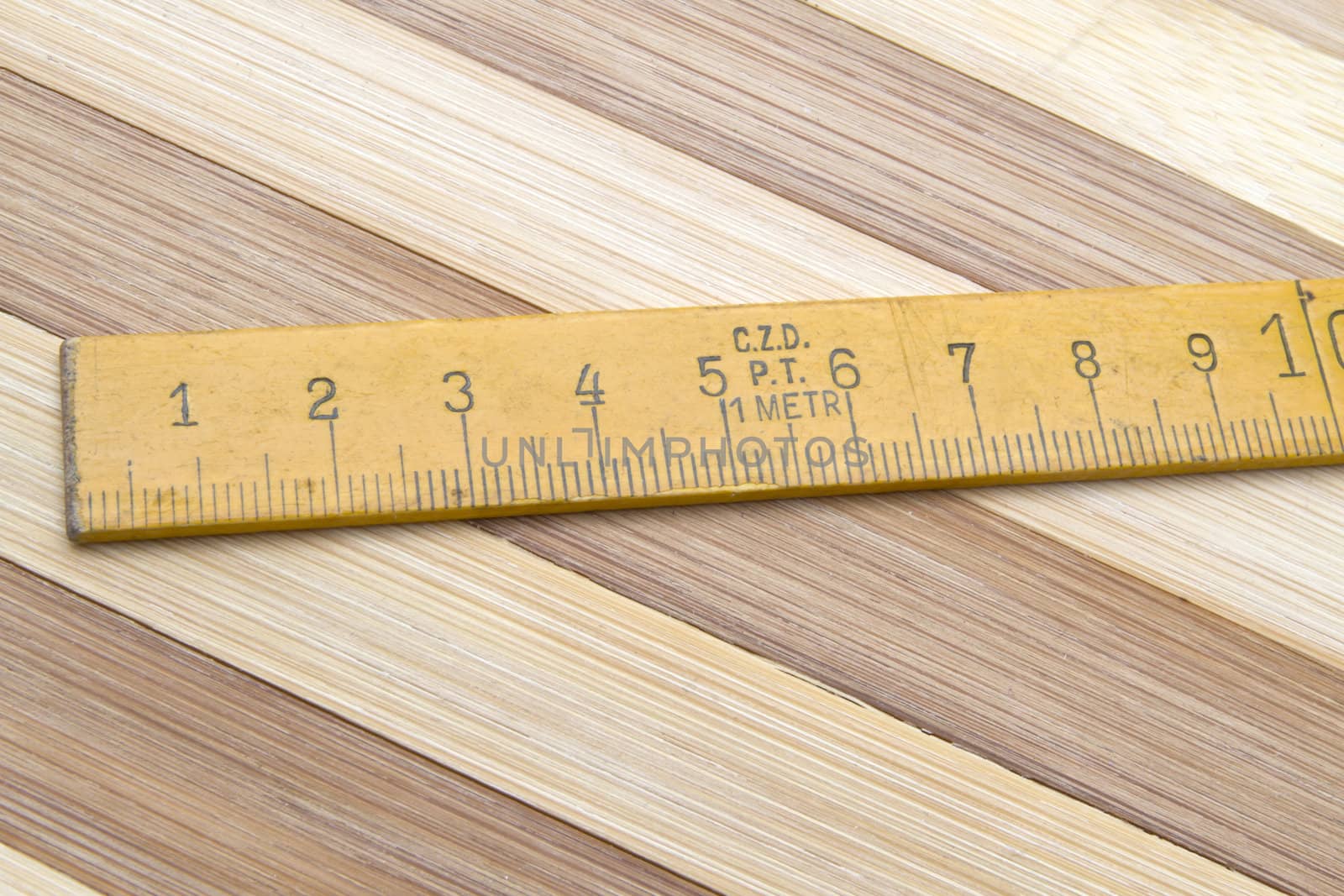 Tape measure closeup on wood background 