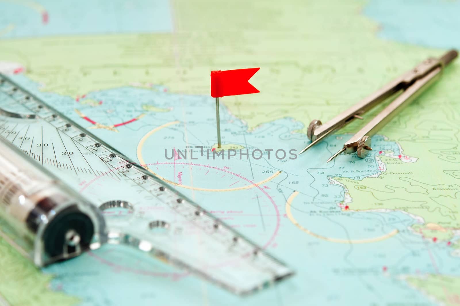 ruler, compasses  and navigation chart. red flag.