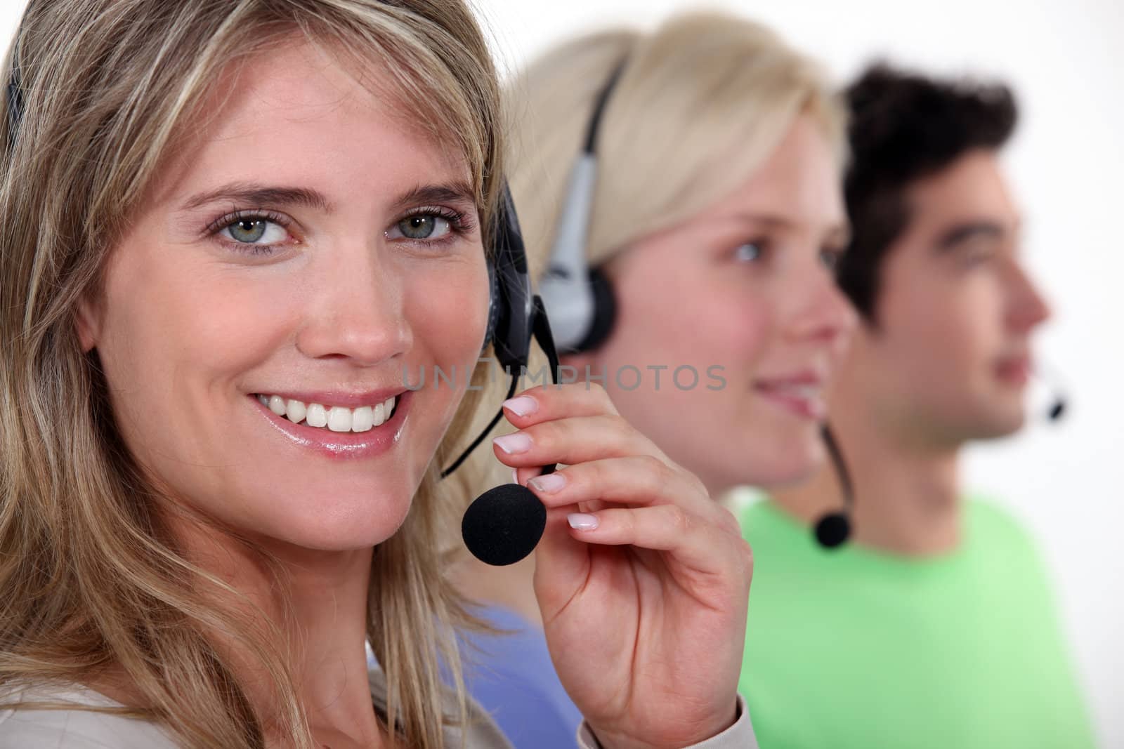 people working in a call center by phovoir