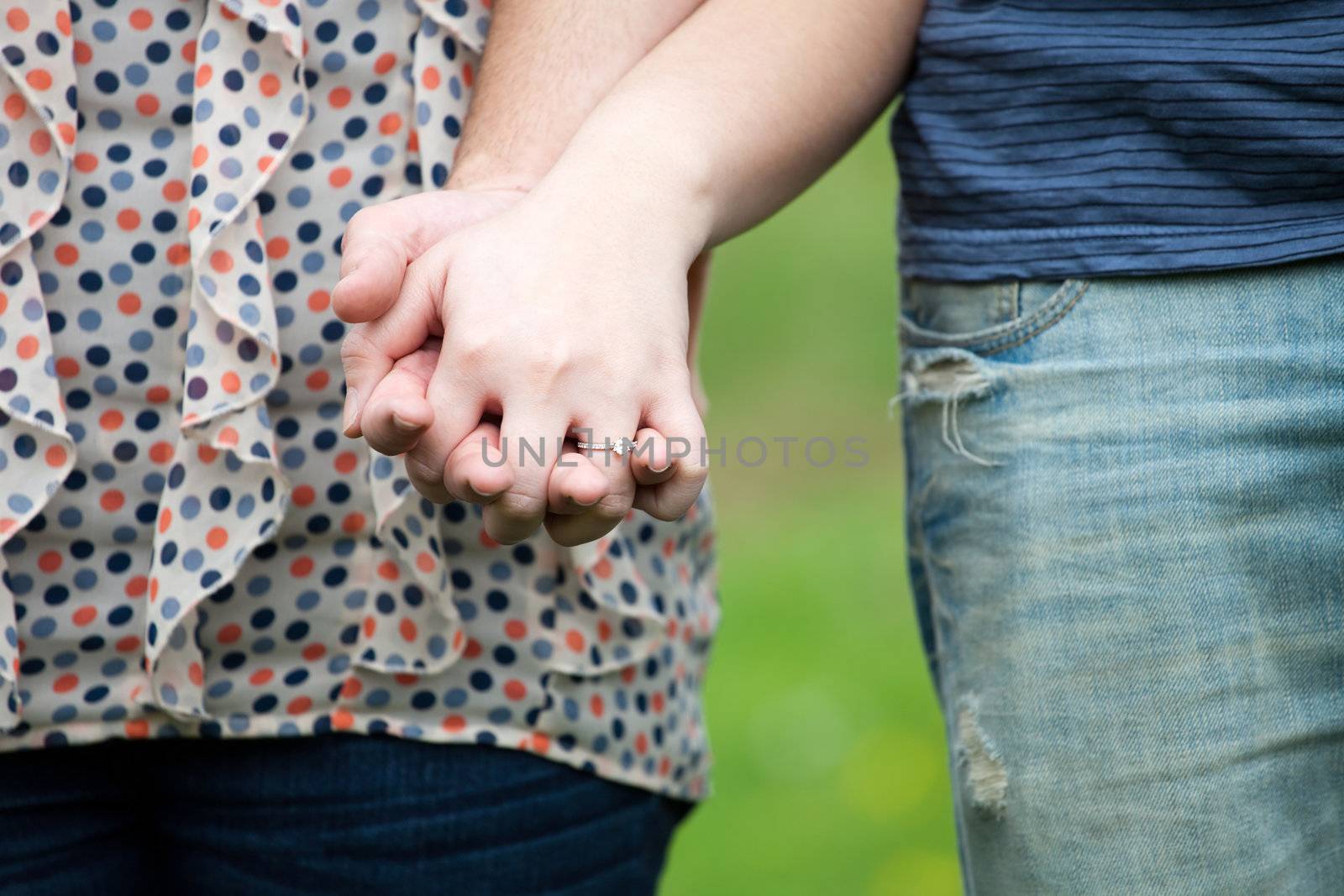 Couple Holds Hands by graficallyminded
