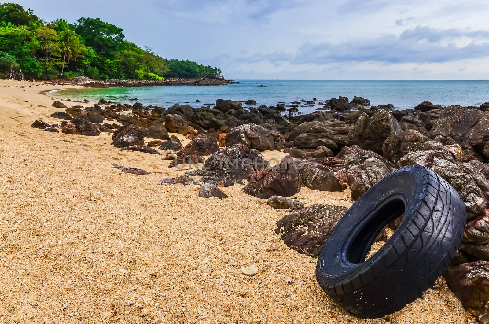 Washed out tyre at beautiful ocean coast in Andaman sea by martinm303