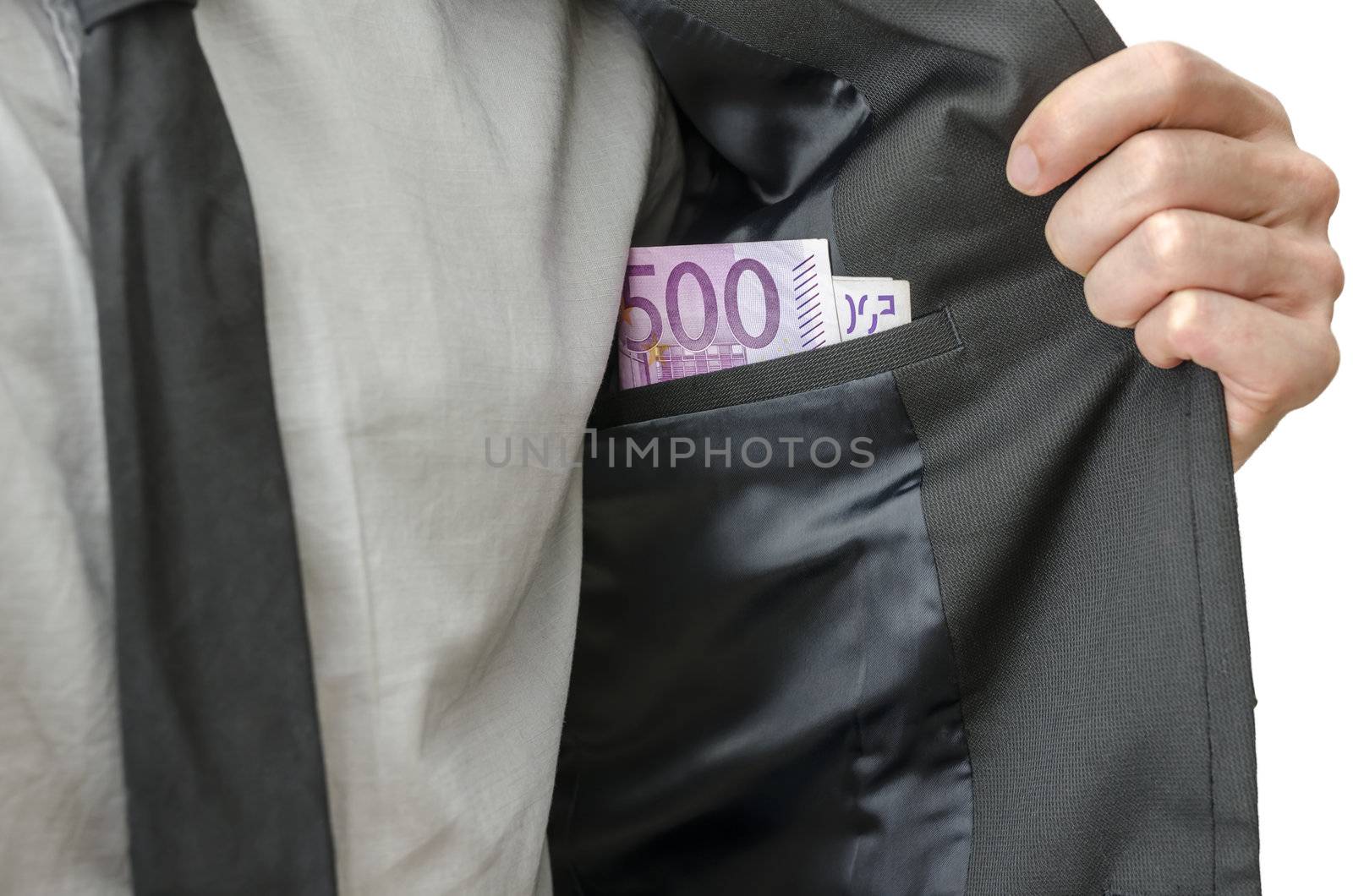 Businessman showing money in inner pocket of his suit. Concept of corrupted businessman.