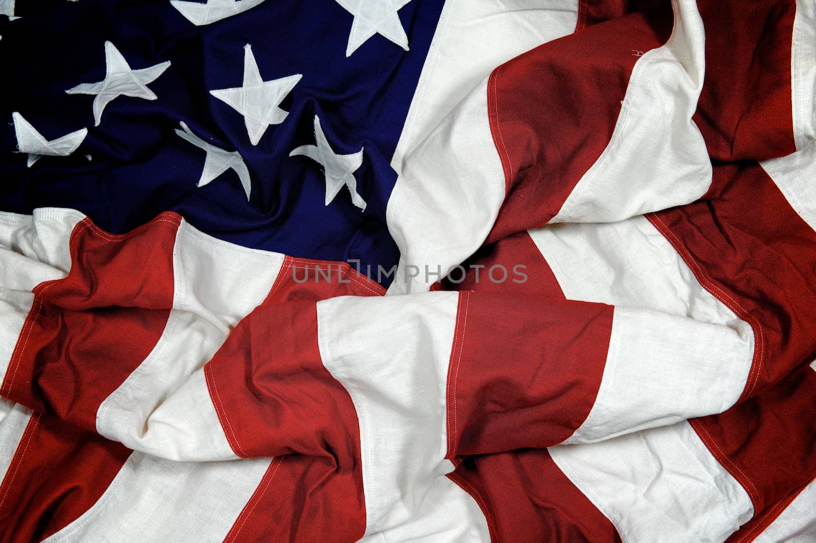 A crumpled American flag with muted tones