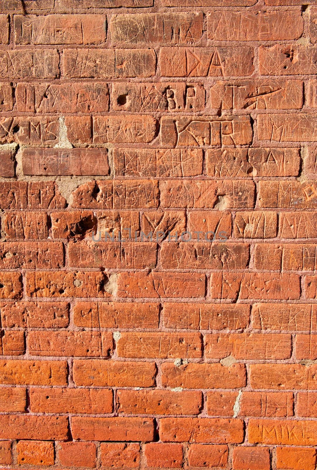 Grungy Brick Wall With Carvings by pixelsnap