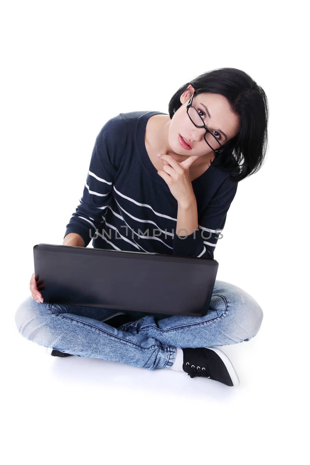 A young woman with a laptop sitting by BDS