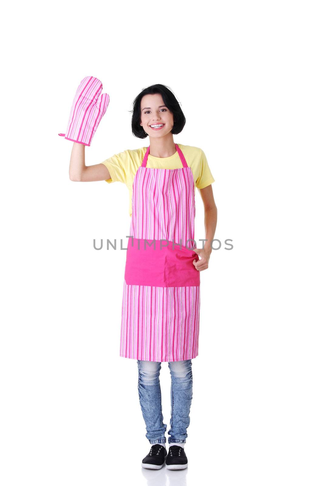 Young housewife in pink apron ang glove, isolated on white