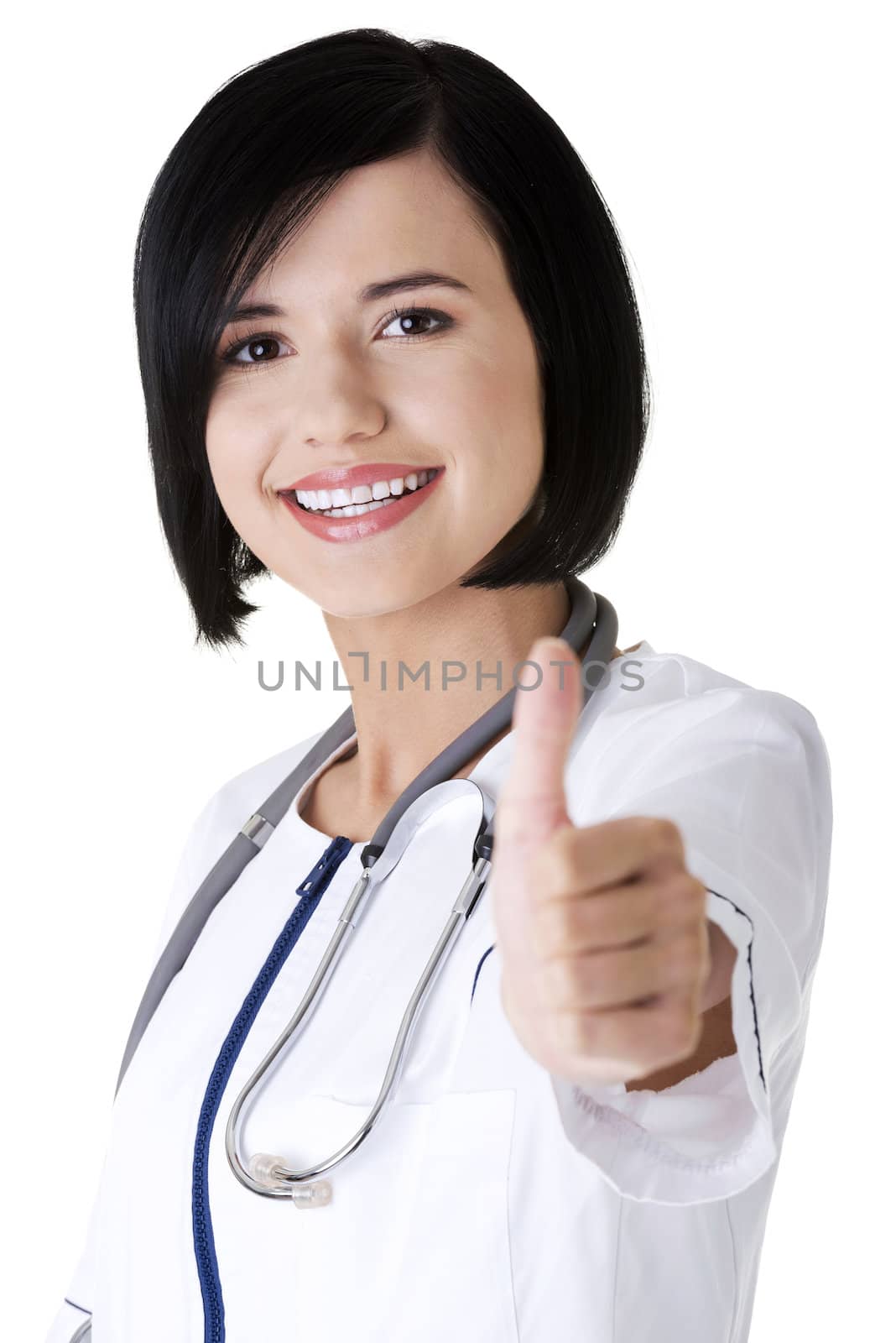 Young female doctor showin OK gesture. Isolated on white.