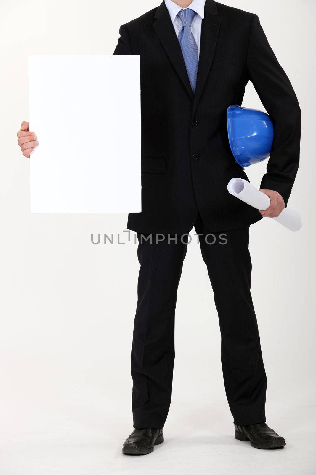 Architect with plans and blank message board by phovoir
