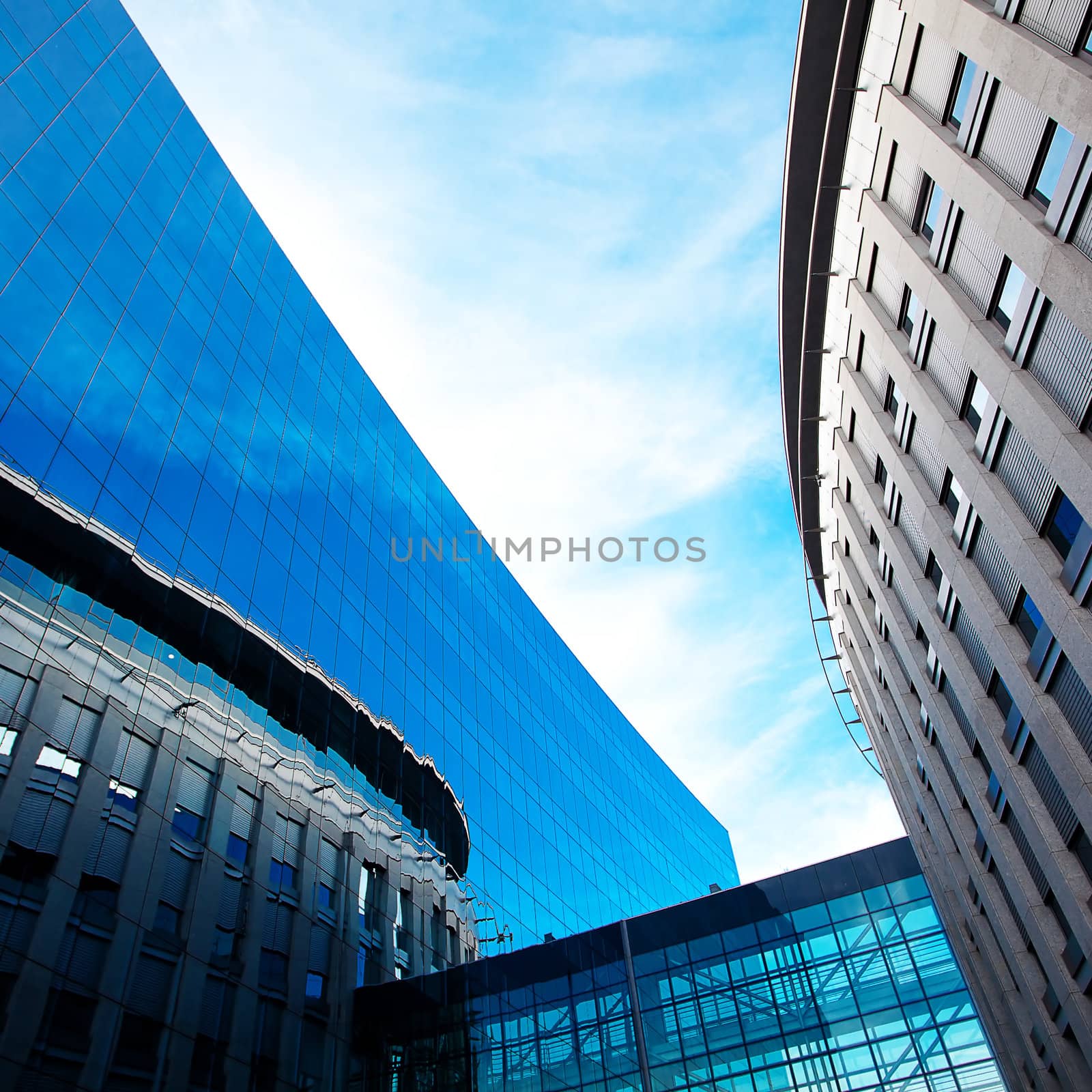 modern office building against the blue sky by jannyjus