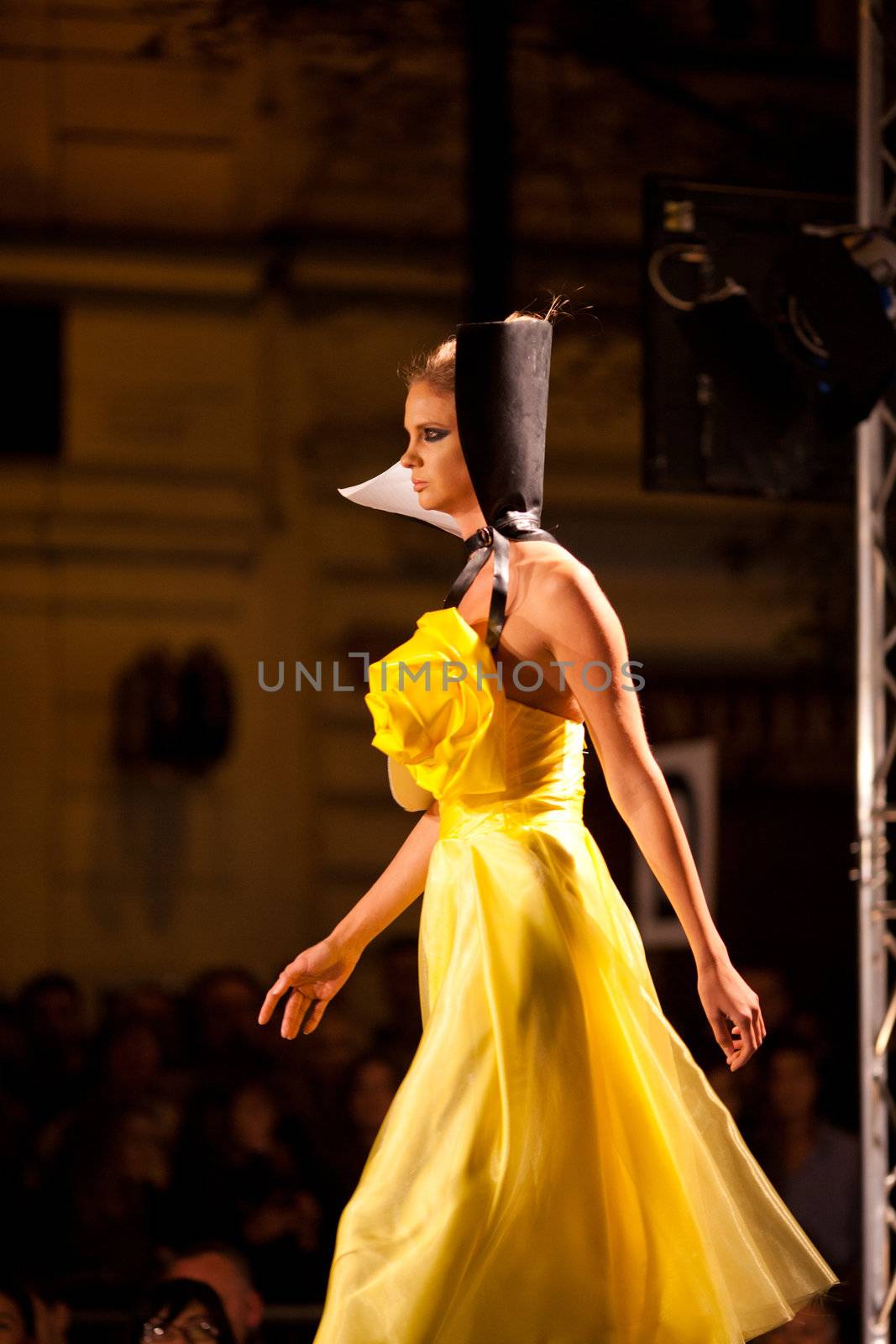 PRAGUE-SEPTEMBER 24: A model walks the runway during the 2011 autumn/winter Nina Ricci Paris Collection by Obsession during the Prague Fashion Weekend on September 24, 2011 in Prague, Czech Republic.