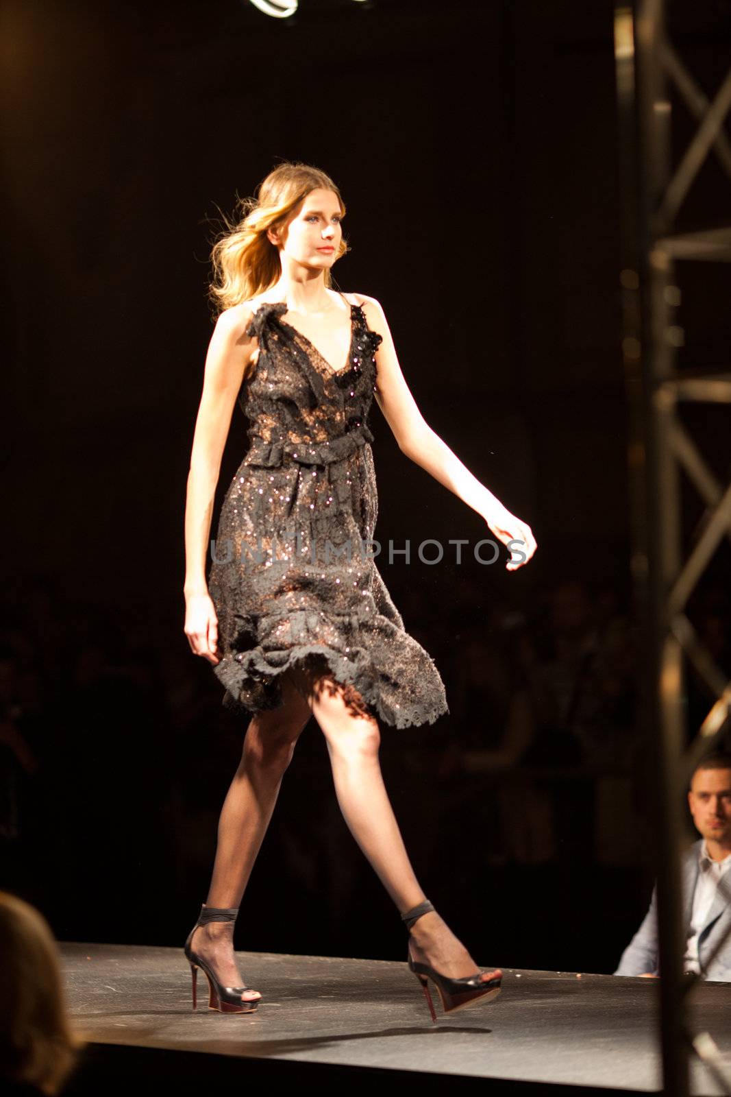 PRAGUE-SEPTEMBER 24: A model walks the runway during the 2011 autumn/winter Nina Ricci Paris Collection by Obsession during the Prague Fashion Weekend on September 24, 2011 in Prague, Czech Republic.