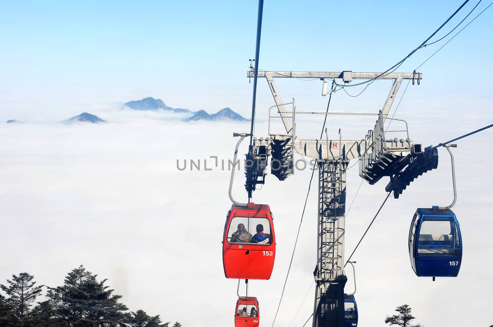 Cable cars in a foggy and cloudy day