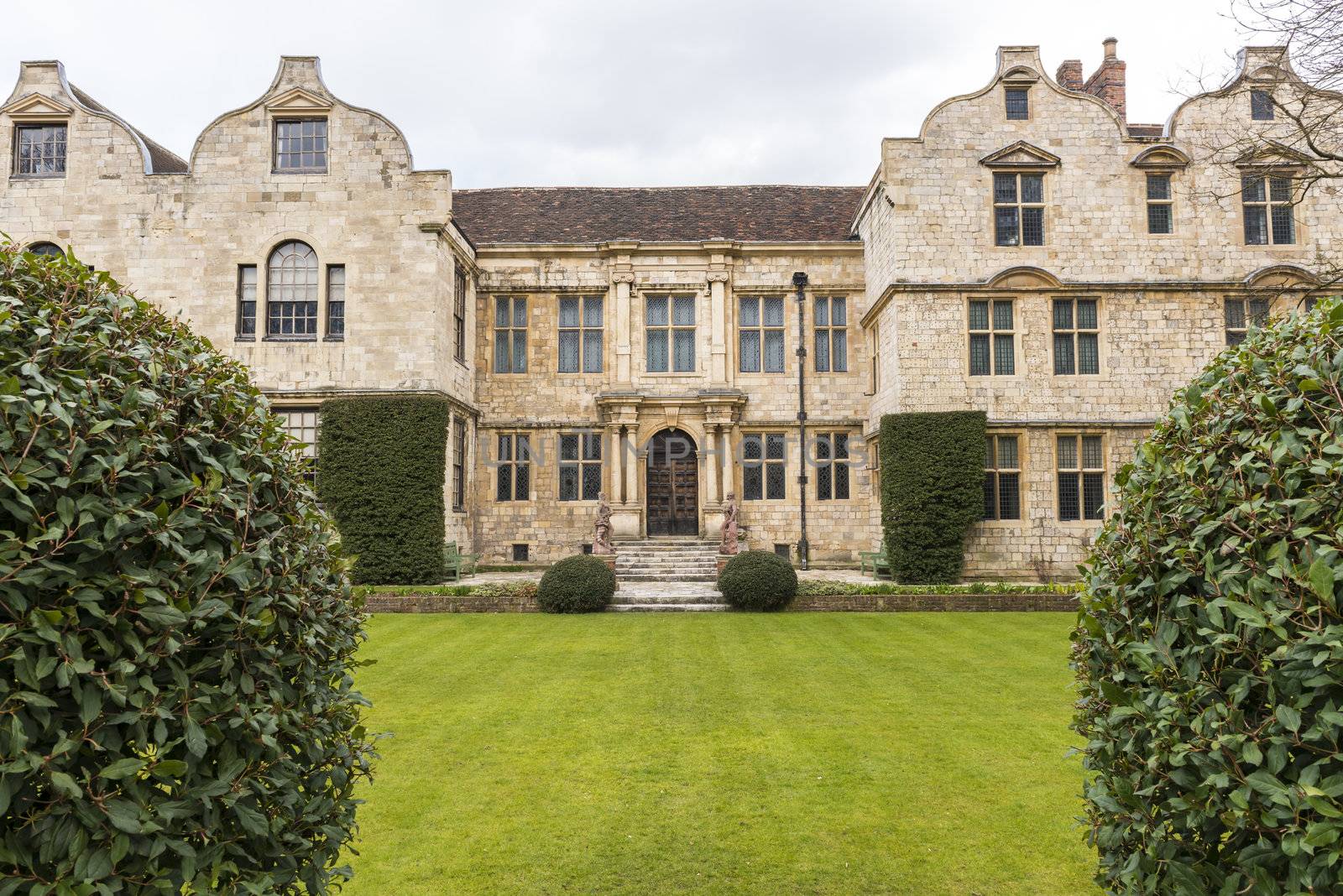 YORK, UK - MARCH 30: The Treasurer's House's garden and back of the house. The site is considered to be one of the most haunted in Europe. March 30, 2013 in York.