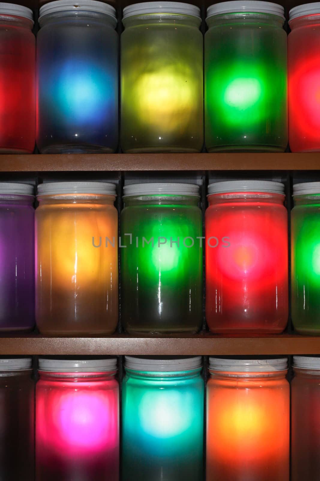 Selection of jars with multicolored light shining through them