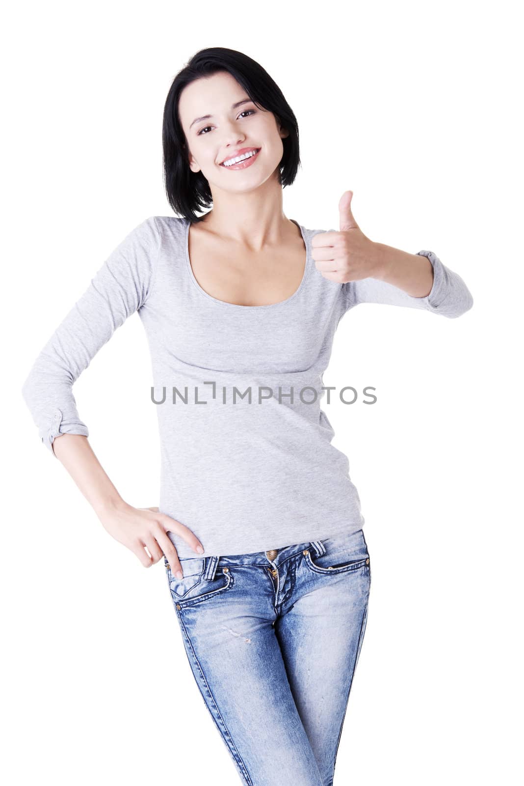 Beautiful young woman showing thumbs up sign by BDS