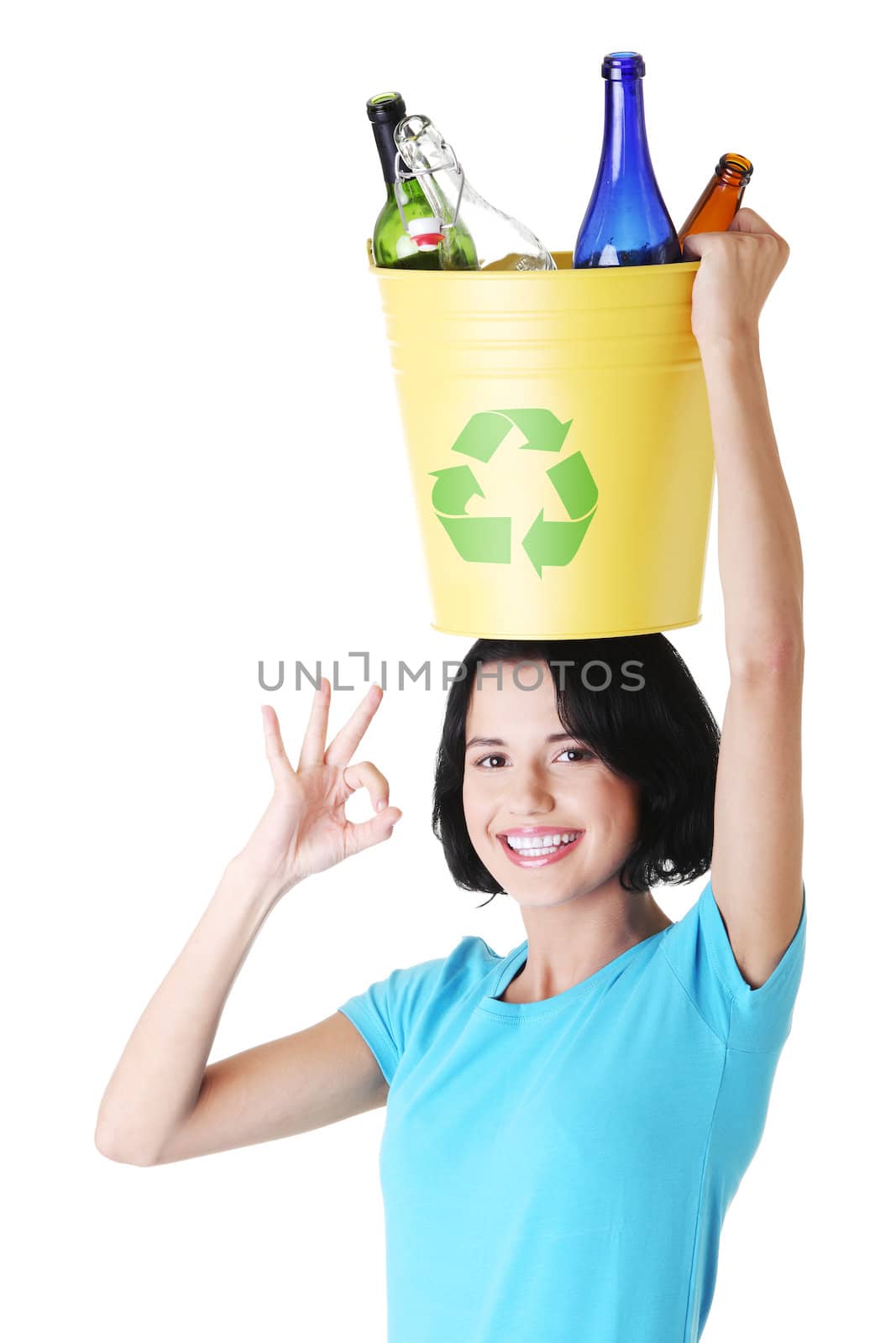 Beautiful young woman holding recycling basket by BDS