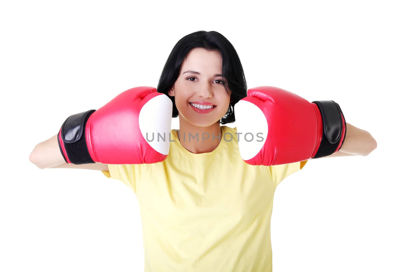 Young woman wearing a pair of boxing gloves. Student woman ready for exams