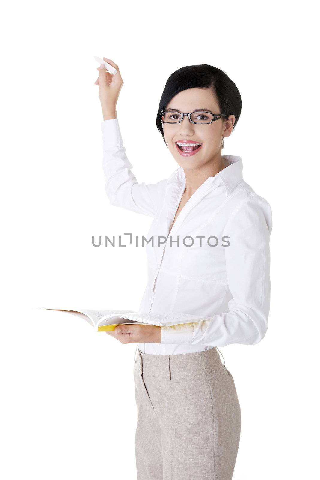 Teacher with book and chalk in hands presenting something on abstract chalkboard. Isolated on white