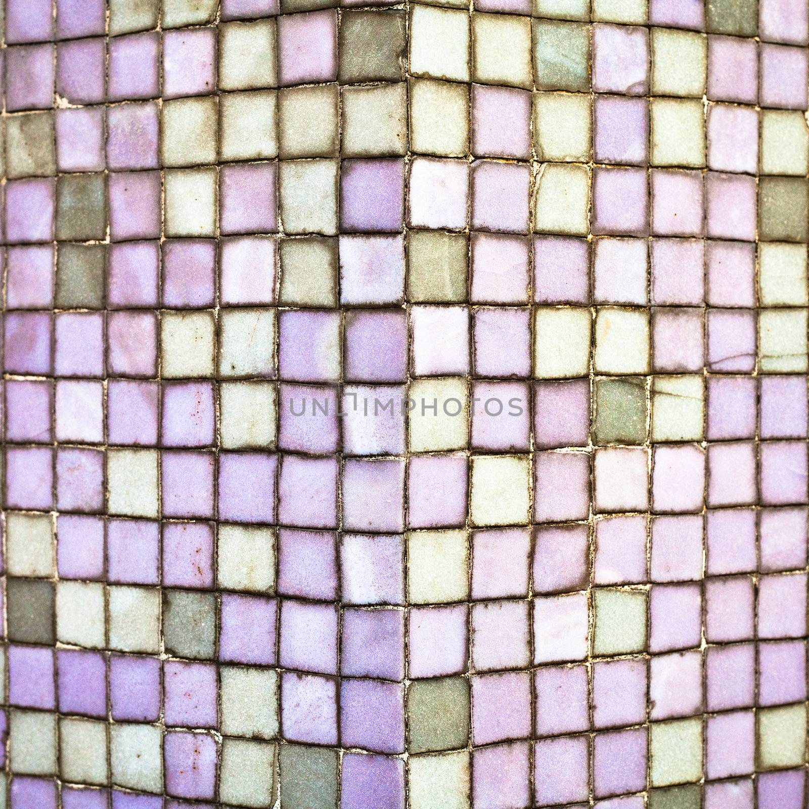 Purple tiles on the corner of a wall