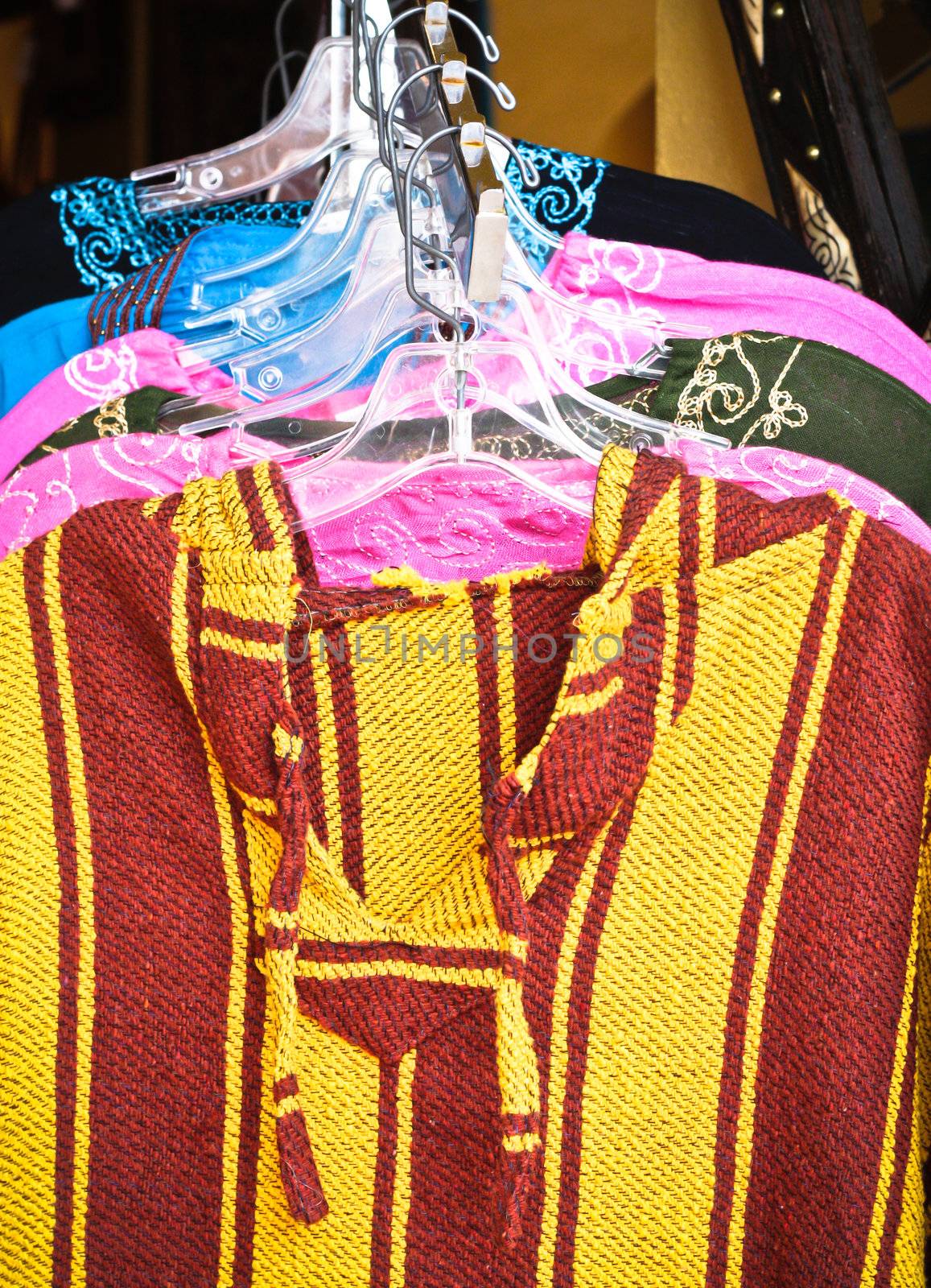 Traditional moroccan clothes in a market stall