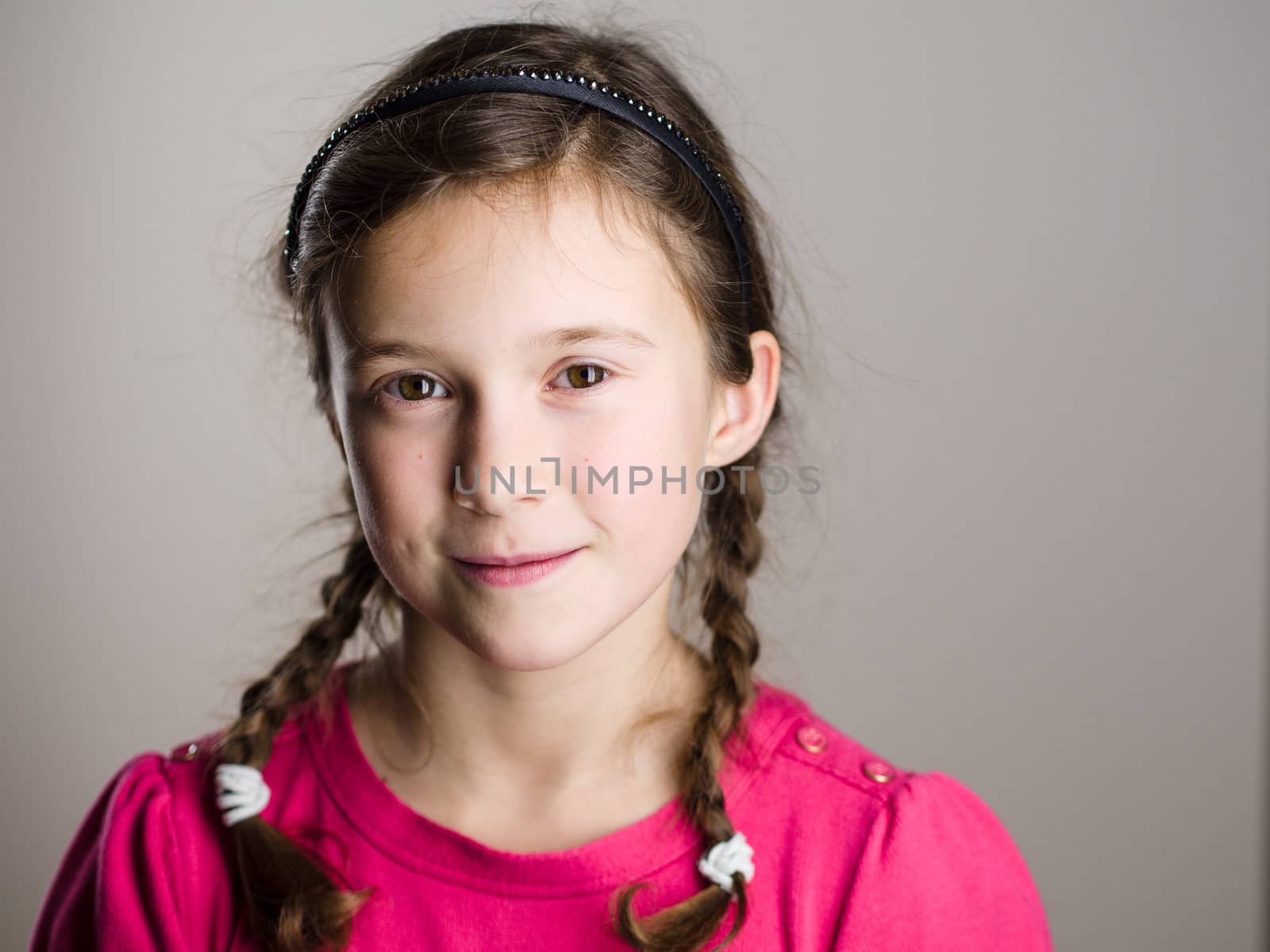 Cute little girl smiling in studio