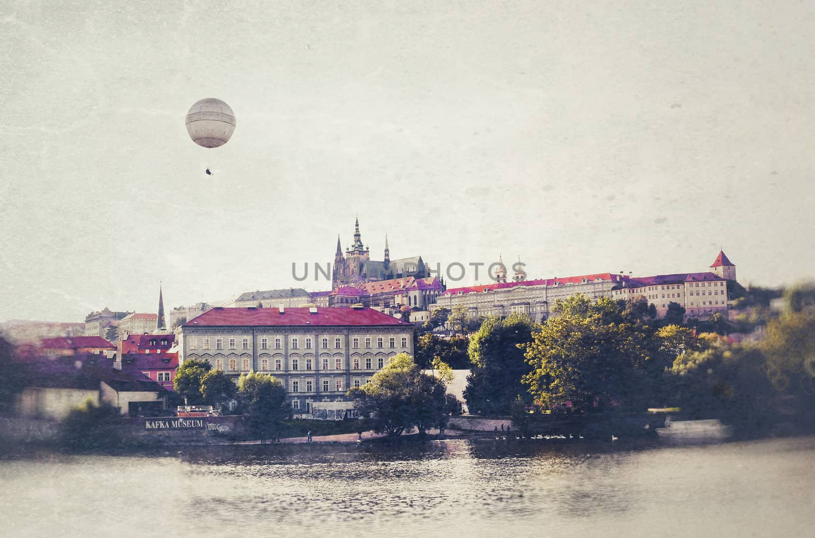 Prague Photo in vintage style. Balloon over the river Vltava near the museum of Franz Kafka