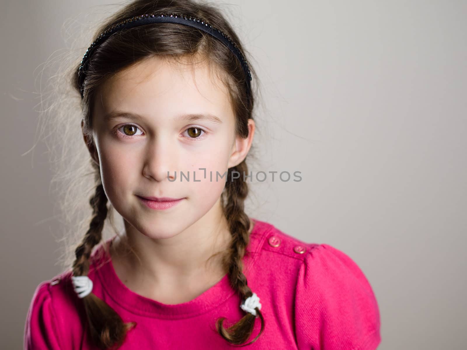 Cute little girl smiling in studio