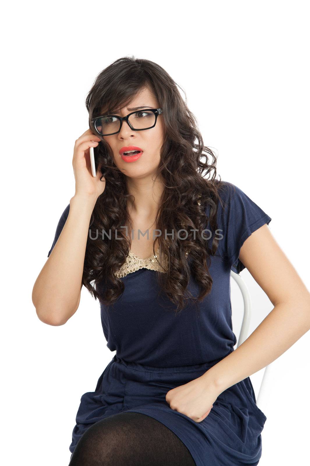 Woman in glasses emotionally speaks on a mobile phone